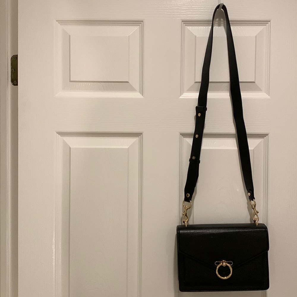 Rebecca Minkoff black structured crossbody with 3 compartments.